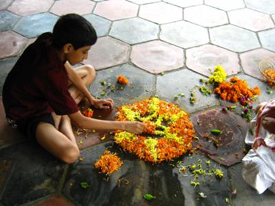Preparing Pookalam for Onam